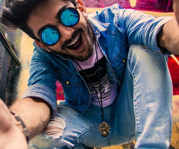 Happy person feeling energetic and vibrant outdoors.